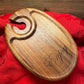 Rustic wooden wine glass holder with the engraved word 'Enjoy,' featuring a sleek design and a slot for holding a wine glass stem.