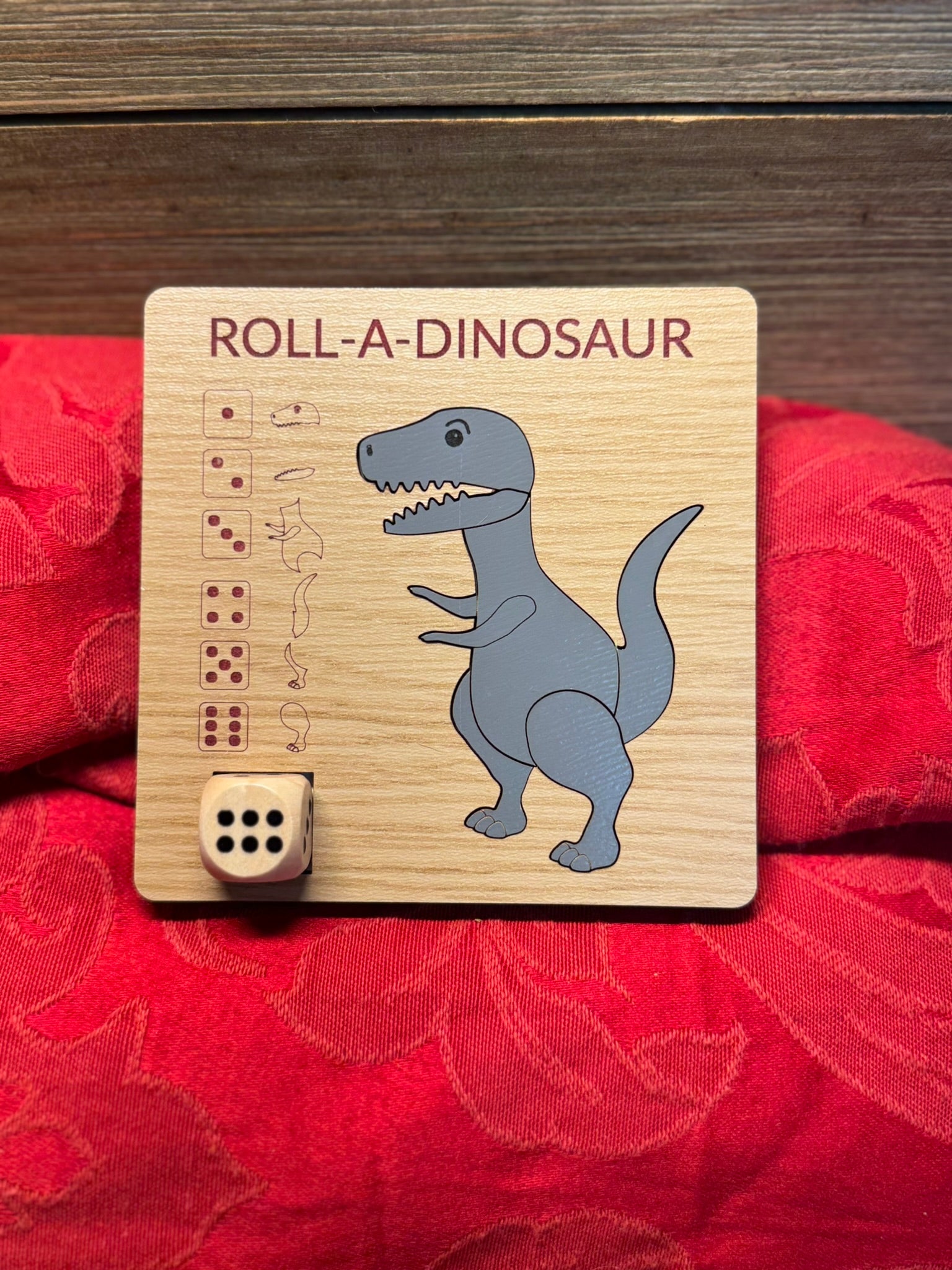 Roll-A-DInosaur wooden dice game with a vibrant red tulip design, ideal for craft-loving kids and adults